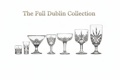 Set of six crystal glasses of different shapes and sizes on a white background